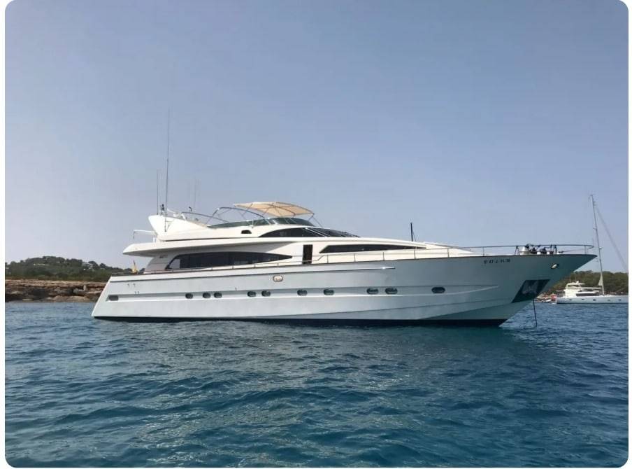 Airbnb Hosting A white motor yacht is floating in the water, Airbnb