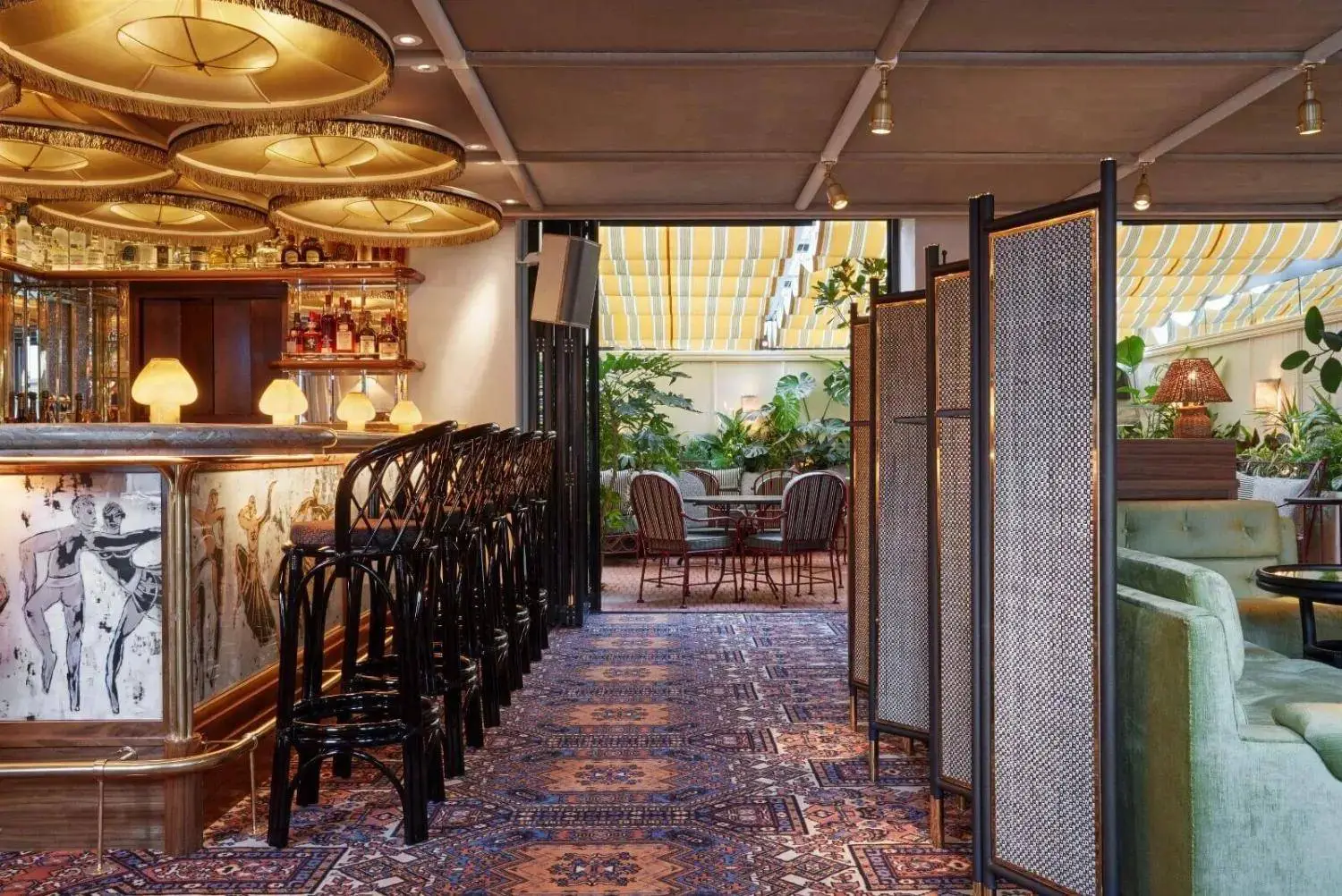 Airbnb Hosting The interior of a restaurant with a bar and chairs.