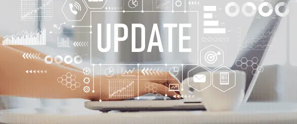 Airbnb Hosting A person typing on a laptop while implementing Airbnb optimization strategies.